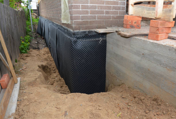 Happy homeowners after waterproofing job in Helena